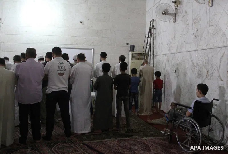 Syrian Muslim worshipers attend Laylat Al Qadr prayers on the 27th day of the holy fasting month of Ramadan at a mosque in al-Kalasa district in the northern Syrian city of Aleppo, on July 13, 2015. Muslims fasting in th...