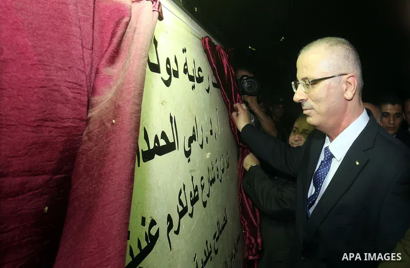 Palestinian Prime Minister Rami Hamdallah attend the opening ceremony of Tulkarem road lighting project, in the West Bank city of Tulkarem, on July 15, 2015. Photo by Prime Minister Office