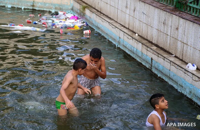 Egyptians swim as they celebrate Eid al-Fitr at Mustafa Mahmoud pond, in Cairo, Egypt, on July 17, 2015. Eid al-Fitr marks the end of the Muslim holy month of Ramadan. Photo by Amr Sayed