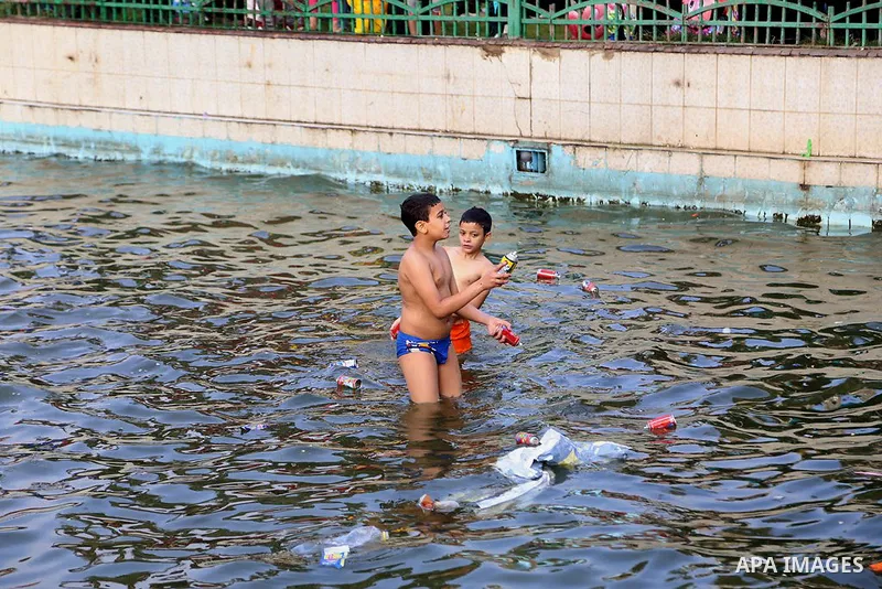 Egyptians swim as they celebrate Eid al-Fitr at Mustafa Mahmoud pond, in Cairo, Egypt, on July 17, 2015. Eid al-Fitr marks the end of the Muslim holy month of Ramadan. Photo by Amr Sayed