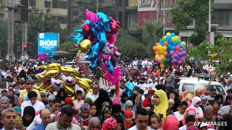 Egyptians celebrate Eid al-Fitr in Cairo, Egypt, on July 17, 2015. Eid al-Fitr marks the end of the Muslim holy month of Ramadan. Photo by Amr Sayed