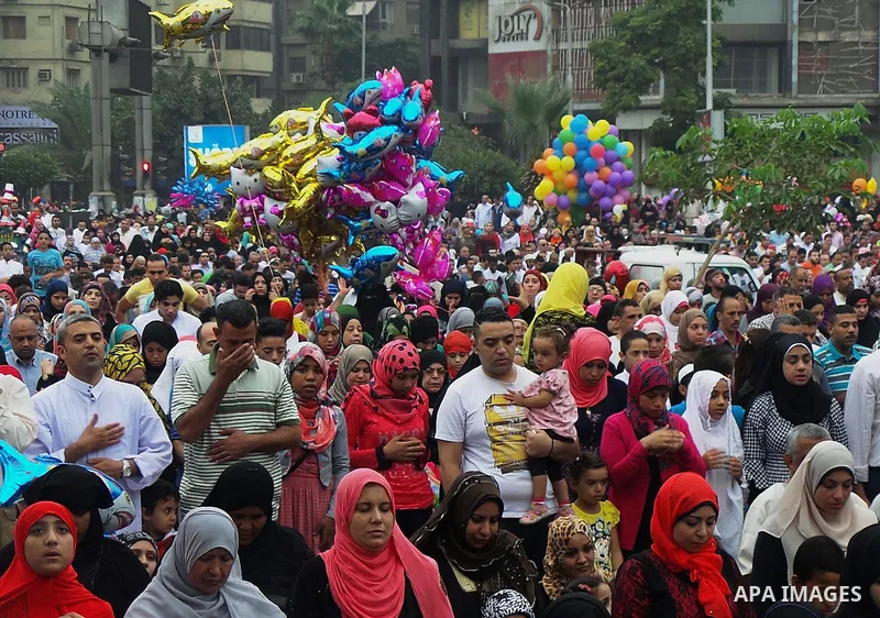 Egyptians celebrate Eid al-Fitr in Cairo, Egypt, on July 17, 2015. Eid al-Fitr marks the end of the Muslim holy month of Ramadan. Photo by Amr Sayed
