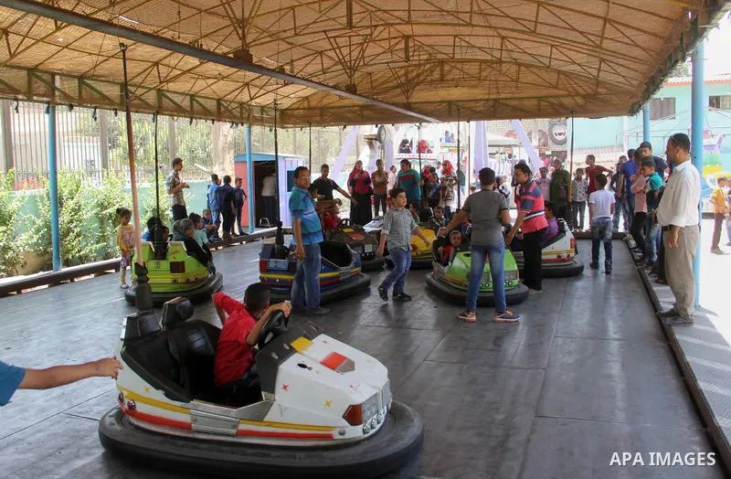 Egyptians enjoy playing games at Japanese park, in Cairo July 18, 2015, on the second day of Eid al-Fitr holiday which marks the end of the Muslim holy month of Ramadan. Photo by Amr Sayed