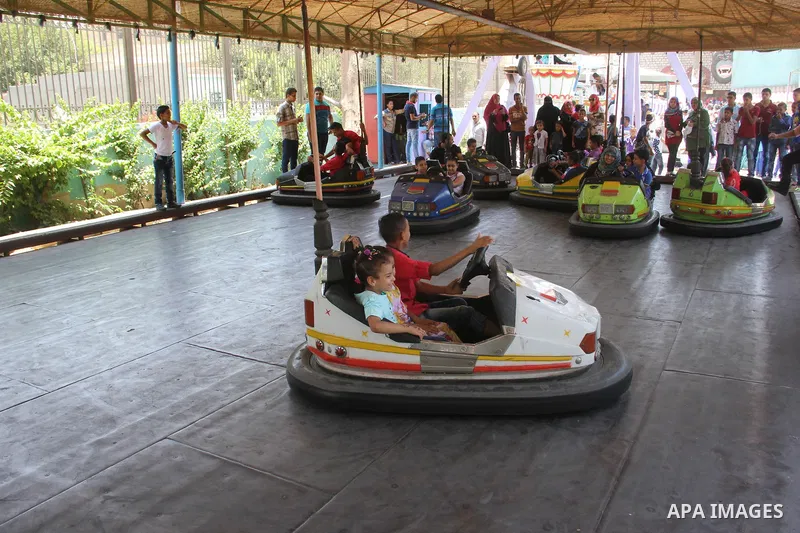 Egyptians enjoy playing games at Japanese park, in Cairo July 18, 2015, on the second day of Eid al-Fitr holiday which marks the end of the Muslim holy month of Ramadan. Photo by Amr Sayed