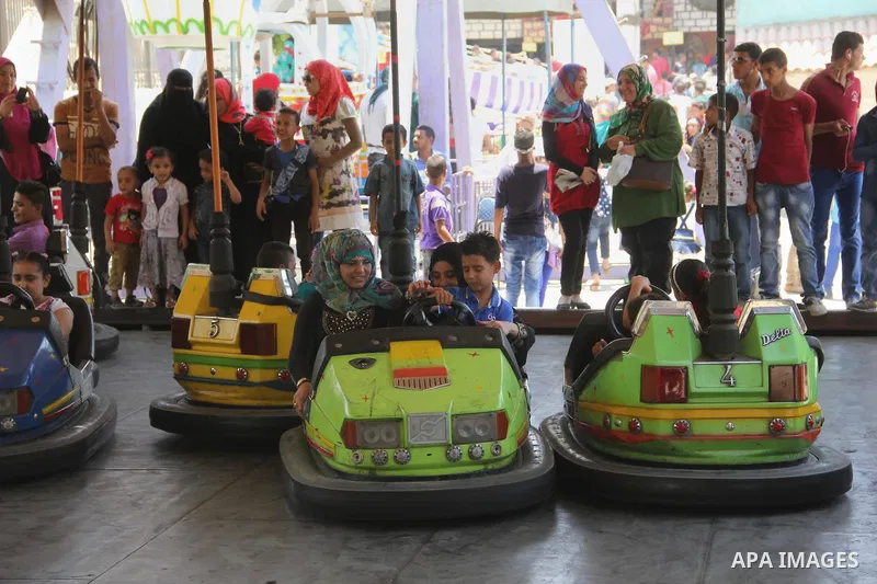 Egyptians enjoy playing games at Japanese park, in Cairo July 18, 2015, on the second day of Eid al-Fitr holiday which marks the end of the Muslim holy month of Ramadan. Photo by Amr Sayed