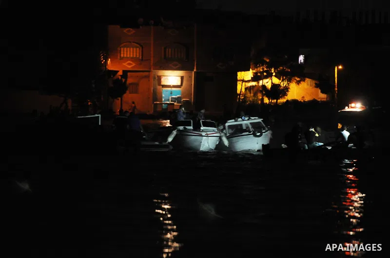 Egyptian rescuers search for the missing on the Nile River in the Warraq district of Giza, southwest of Cairo, Egypt, on July 23, 2015. At least 19 people died on Wednesday late night in a shipwreck on the Nile River, ac...