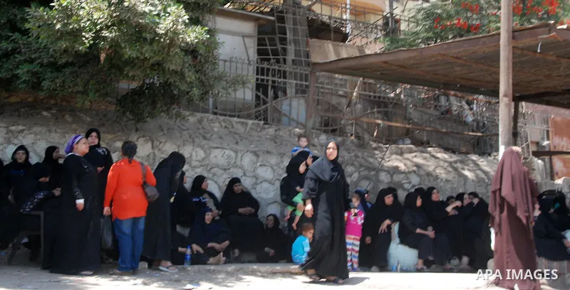 Egyptian women mourn for victims of a passenger boat after it sunk, outside the Nasser Institute hospital, in Cairo, Egypt, on July 23, 2015. At least 19 people died on Wednesday late night in a shipwreck on the Nile Riv...