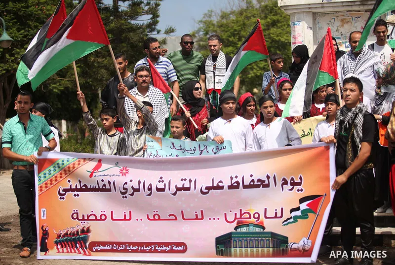 Palestinians take part in a rally to mark of the Palestinian heritage, in Gaza city , July 25, 2015. Photo by Ashraf Amra