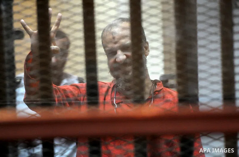 Members of Muslim Brotherhood group, attend their trial in a court in Cairo on July 27, 2015. Cairo Criminal court resumes on Monday, the trial of ousted President, Mohamed Morsi alongside 24 other prominent Brotherhood...