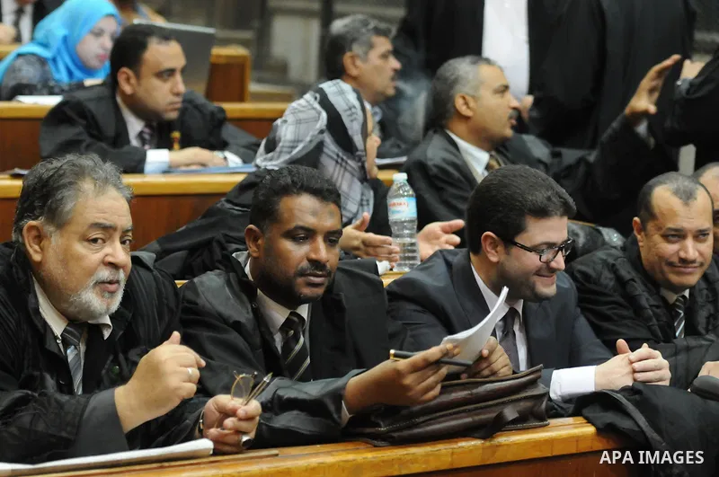 Lawyers attend the trial of Muslim Brotherhood members in a court in Cairo on July 27, 2015. Cairo Criminal court resumes on Monday, the trial of ousted President, Mohamed Morsi alongside 24 other prominent Brotherhood a...