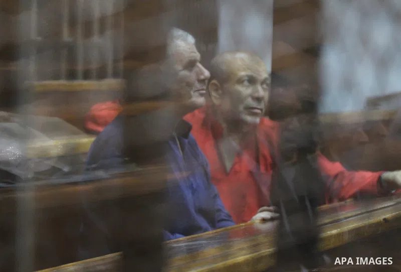Members of Muslim Brotherhood group, attend their trial in a court in Cairo on July 27, 2015. Cairo Criminal court resumes on Monday, the trial of ousted President, Mohamed Morsi alongside 24 other prominent Brotherhood...