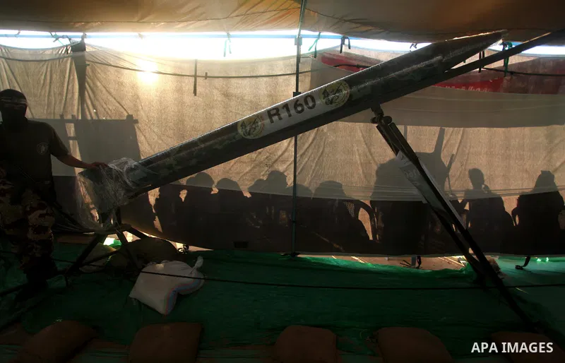 Palestinians watch weapons that used during the Israeli 50-day war on Gaza Strip last summer, during a weapons exhibition in a military-style camp organized by the Hamas movement in Gaza City on July 28, 2015. Hamas's ar...
