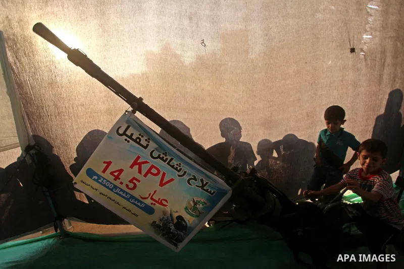 Palestinians watch weapons that used during the Israeli 50-day war on Gaza Strip last summer, during a weapons exhibition in a military-style camp organized by the Hamas movement in Gaza City on July 28, 2015. Hamas's ar...