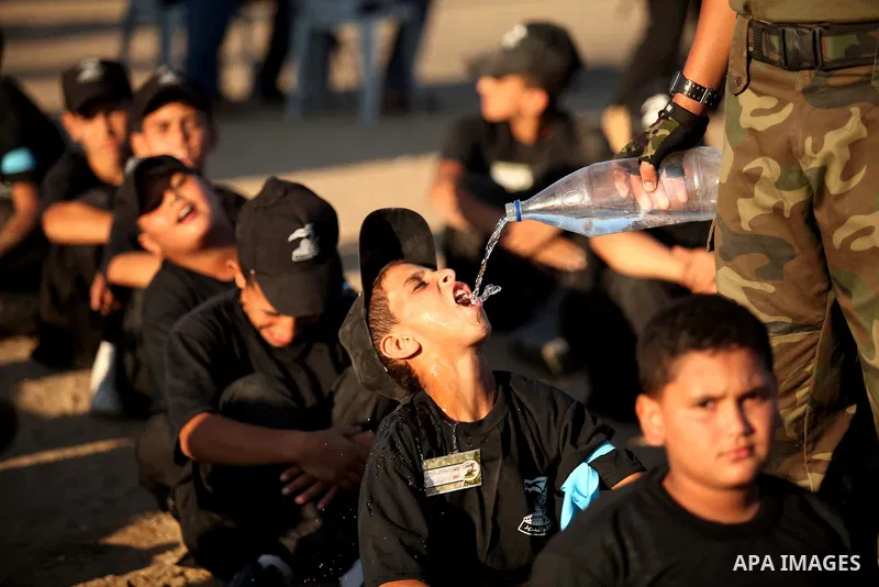 Palestinian youths attend a military-style camp organized by the Hamas movement in Gaza City on July 28, 2015. Hamas's armed wing organized "Liberation Youths Camps" for young Palestinians aged between 15 and 21 to prepa...