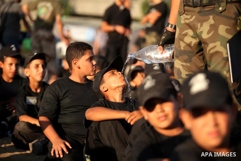 Palestinian youths attend a military-style camp organized by the Hamas movement in Gaza City on July 28, 2015. Hamas's armed wing organized "Liberation Youths Camps" for young Palestinians aged between 15 and 21 to prepa...