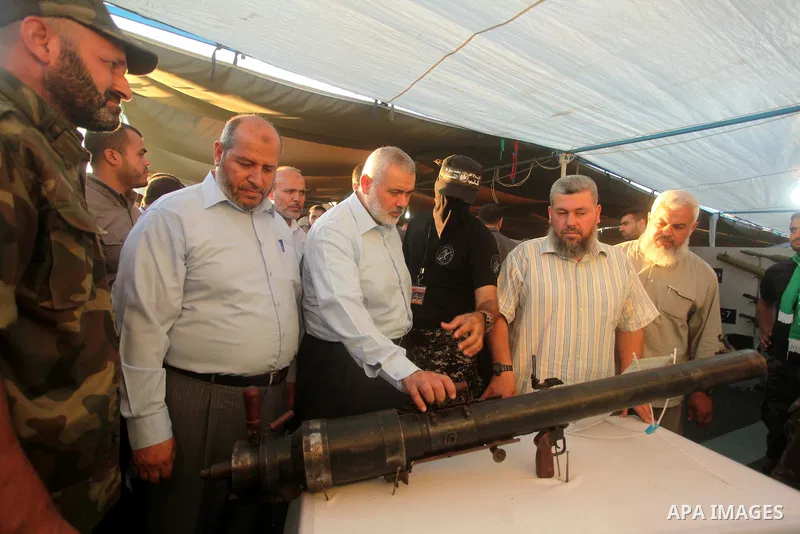 Senior Hamas leader Ismail Haniyeh, attends a weapons exhibition, that used during the Israeli 50-day war on Gaza Strip last summer, in a military-style camp organized by the Hamas movement in Gaza City on July 28, 2015....