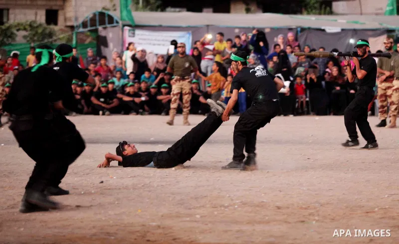 Palestinian youths demonstrate their skills during a military-style camp organized by the Hamas movement in Gaza City on July 28, 2015. Hamas's armed wing organized "Liberation Youths Camps" for young Palestinians aged b...