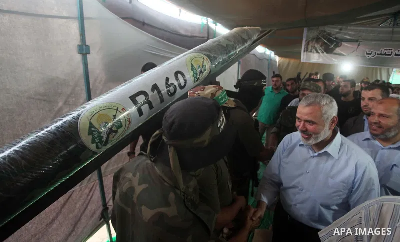 Senior Hamas leader Ismail Haniyeh, attends a weapons exhibition, that used during the Israeli 50-day war on Gaza Strip last summer, in a military-style camp organized by the Hamas movement in Gaza City on July 28, 2015....