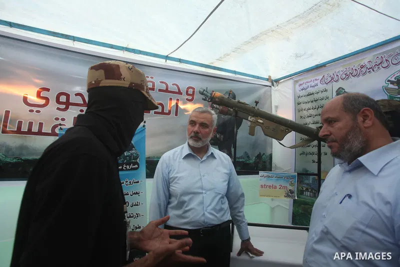 Senior Hamas leader Ismail Haniyeh, attends a weapons exhibition, that used during the Israeli 50-day war on Gaza Strip last summer, in a military-style camp organized by the Hamas movement in Gaza City on July 28, 2015....