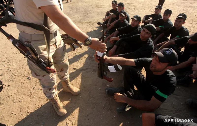 Palestinian youths take part in a military-style camp organized by the Hamas movement in Gaza City on July 28, 2015. Hamas's armed wing organized "Liberation Youths Camps" for young Palestinians aged between 15 and 21 to...