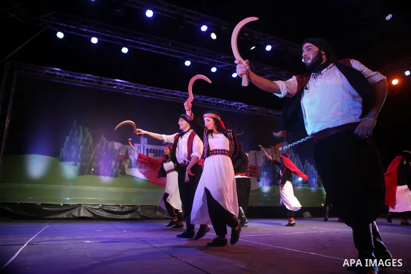 Palestinian from the Jouzour band for dabka perform during the Birzeit Nights Festival at Birzeit University in the West Bank city of Ramallah on July 28, 2015. Photo by Shadi Hatem