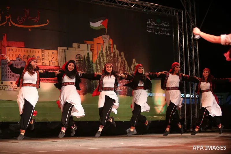 Palestinian from the Jouzour band for dabka perform during the Birzeit Nights Festival at Birzeit University in the West Bank city of Ramallah on July 28, 2015. Photo by Shadi Hatem