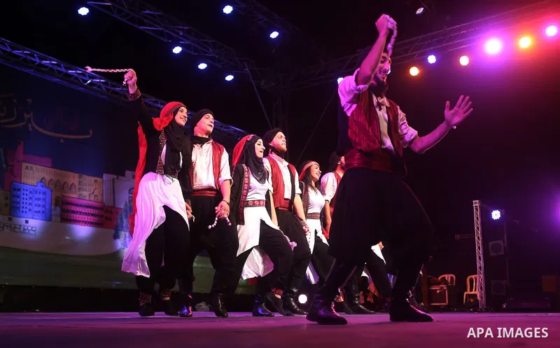 Palestinian from the Jouzour band for dabka perform during the Birzeit Nights Festival at Birzeit University in the West Bank city of Ramallah on July 28, 2015. Photo by Shadi Hatem