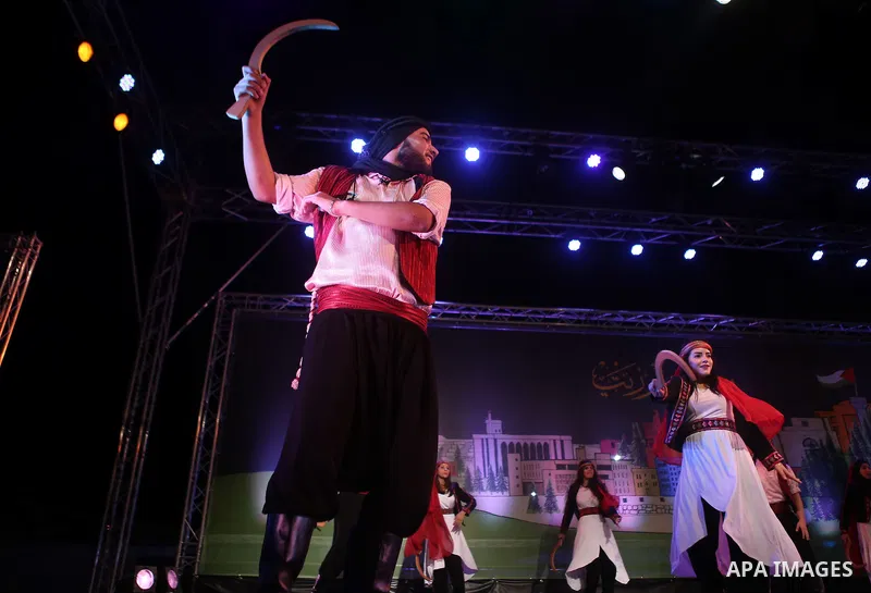 Palestinian from the Jouzour band for dabka perform during the Birzeit Nights Festival at Birzeit University in the West Bank city of Ramallah on July 28, 2015. Photo by Shadi Hatem