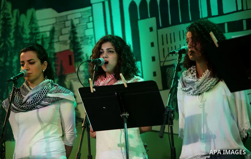 Palestinian youths perform during the Birzeit Nights Festival at Birzeit University in the West Bank city of Ramallah on July 28, 2015. Photo by Shadi Hatem