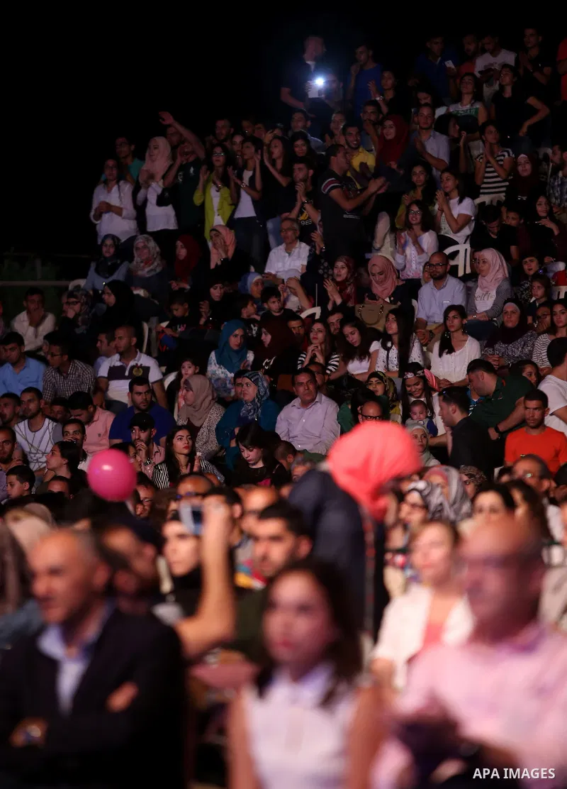 Palestinian youths perform during the Birzeit Nights Festival at Birzeit University in the West Bank city of Ramallah on July 28, 2015. Photo by Shadi Hatem