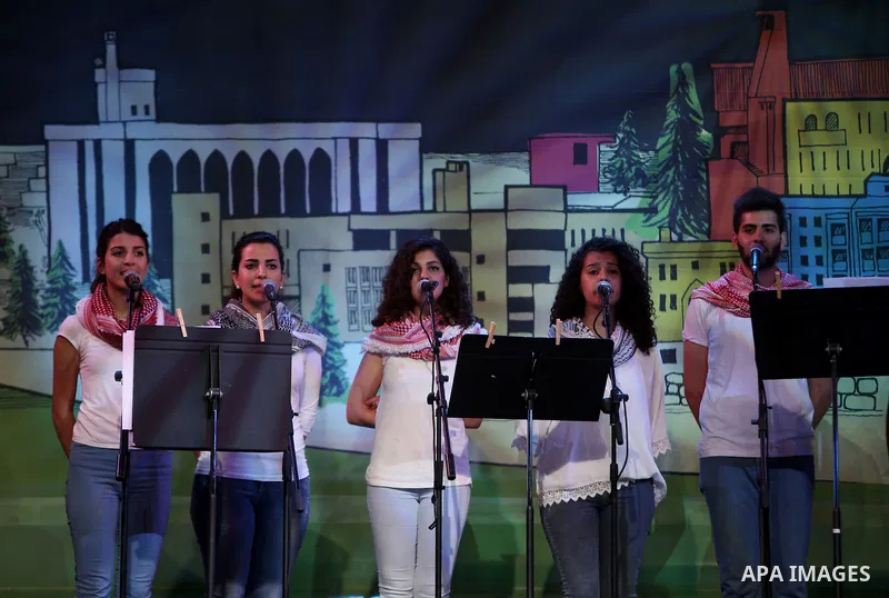 Palestinian youths perform during the Birzeit Nights Festival at Birzeit University in the West Bank city of Ramallah on July 28, 2015. Photo by Shadi Hatem