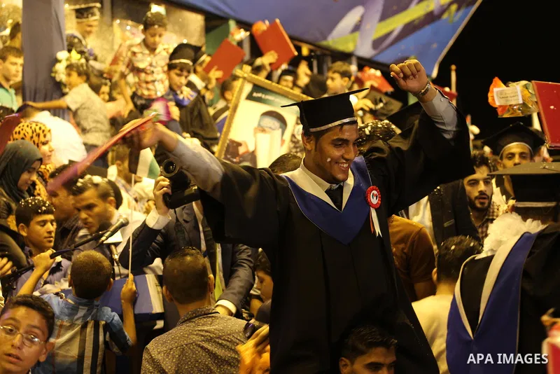 Palestinian students of the University collage of applied science, attend their graduation ceremony, in Gaza city on July 28, 2015. Photo by Mohammed Asad