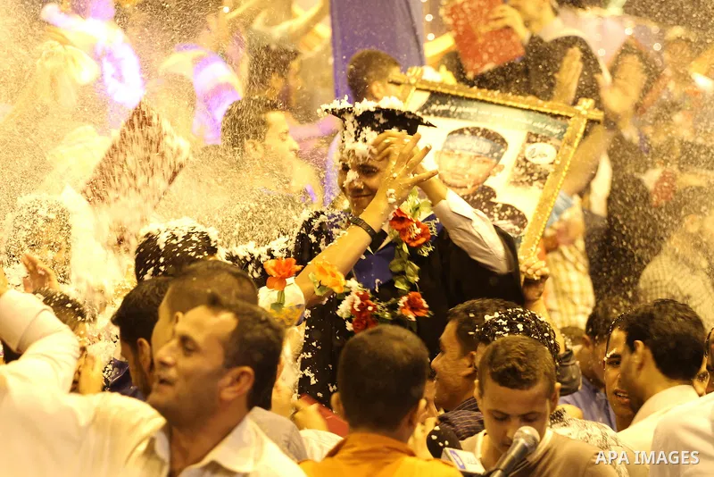 Palestinian students of the University collage of applied science, attend their graduation ceremony, in Gaza city on July 28, 2015. Photo by Mohammed Asad