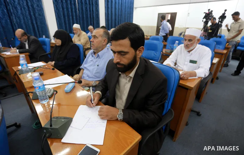 Members of the Palestinian legislative council from Hamas movement attend a meeting at the legislative council in Gaza city on July 29, 2015. Photo by Mohammed Asad