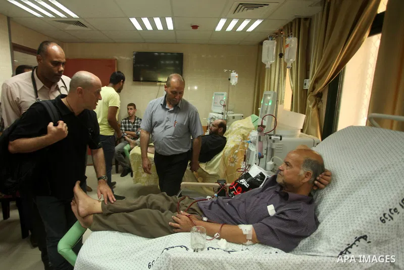 Head of the Red Cross mission in Israel and the Palestinian territories Jacques De Maio, visits the al-Aqsa Martyrs Hospital in Deir al-Balah in the northern Gaza Strip July 29, 2015. Photo by Ashraf Amra