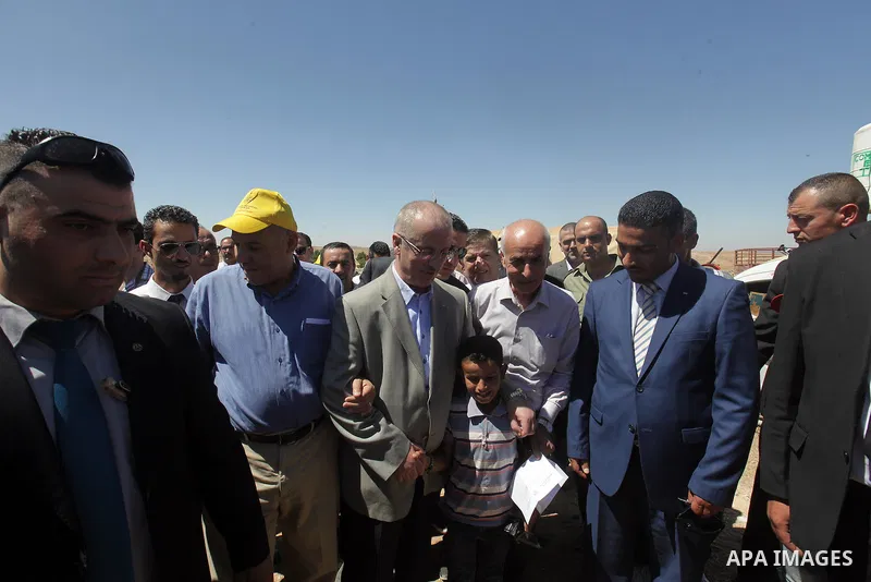 Palestinian prime minister Rami Hamadallah visits the village of Susia outside the West Bank village of Yatta, on June 29, 2015. Photo by Prime Minister Office