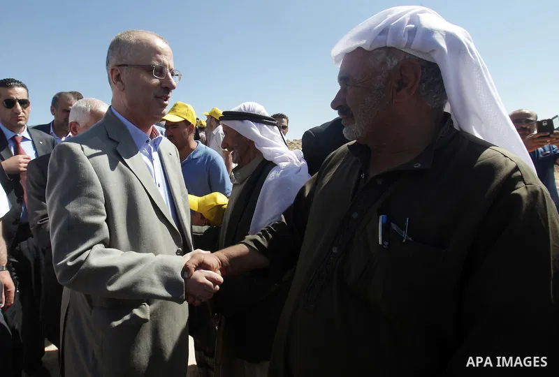 Palestinian prime minister Rami Hamadallah visits the village of Susia outside the West Bank village of Yatta, on June 29, 2015. Photo by Prime Minister Office