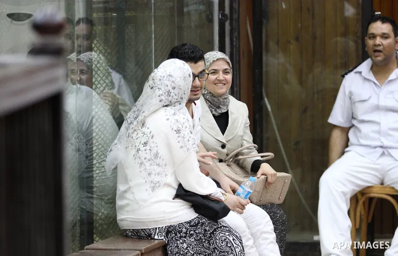 Members of Egyptian 'Ultras of Raba'wi' attend their trial in a court in Cairo on July 29, 2015. Photo by Amr Sayed