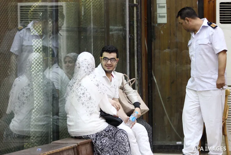 Members of Egyptian 'Ultras of Raba'wi' attend their trial in a court in Cairo on July 29, 2015. Photo by Amr Sayed