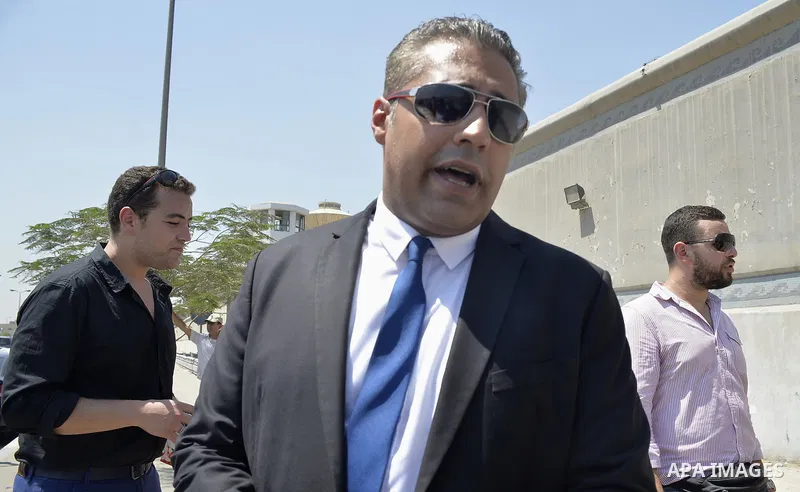 Canadian Al-Jazeera English journalist Mohammed Fahmy, speaks to the media in front of Tora prison, in Cairo, Egypt, Thursday, July 30, 2015. Egyptian judicial officials say a Cairo court has postponed the verdict in the...