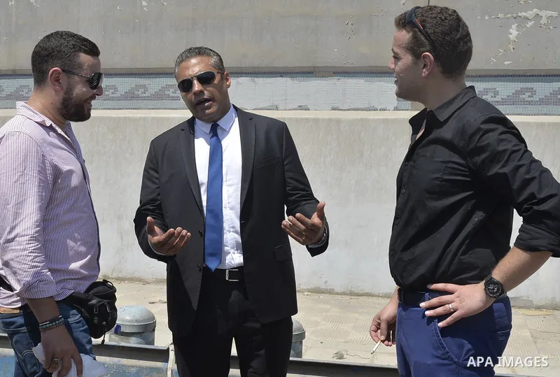 Egyptian Al-Jazeera English journalist Baher Mohammed, and Al-Jazeera English journalist Mohammed Fahmy, speak outside Tora prison, in Cairo, Egypt, Thursday, July 30, 2015. Egyptian judicial officials say a Cairo court...