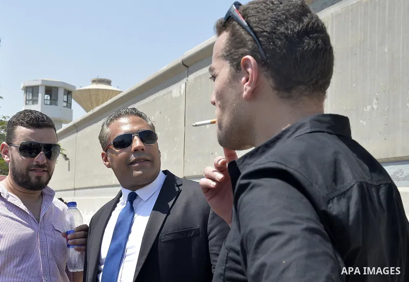Egyptian Al-Jazeera English journalist Baher Mohammed, and Al-Jazeera English journalist Mohammed Fahmy, speak outside Tora prison, in Cairo, Egypt, Thursday, July 30, 2015. Egyptian judicial officials say a Cairo court...