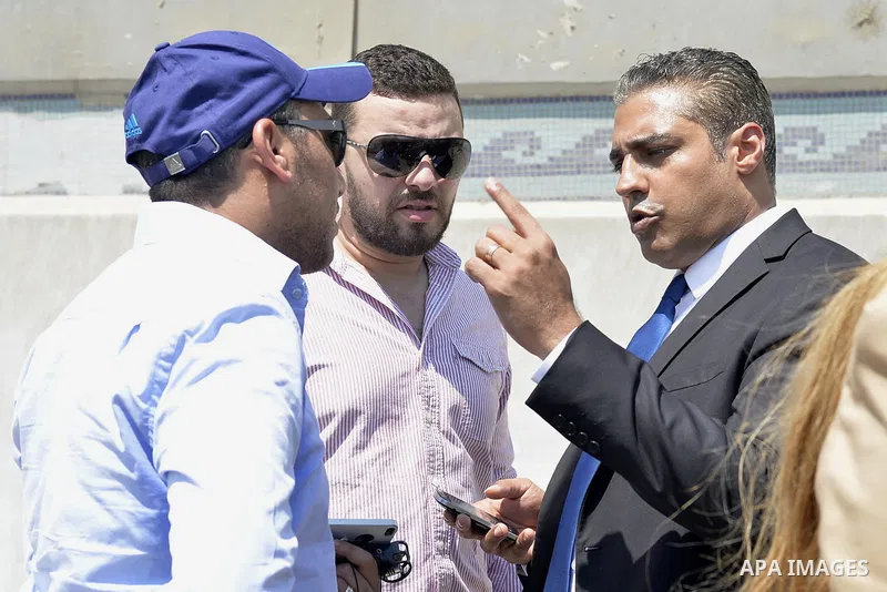 Canadian Al-Jazeera English journalist Mohammed Fahmy, speaks to the media in front of Tora prison, in Cairo, Egypt, Thursday, July 30, 2015. Egyptian judicial officials say a Cairo court has postponed the verdict in the...