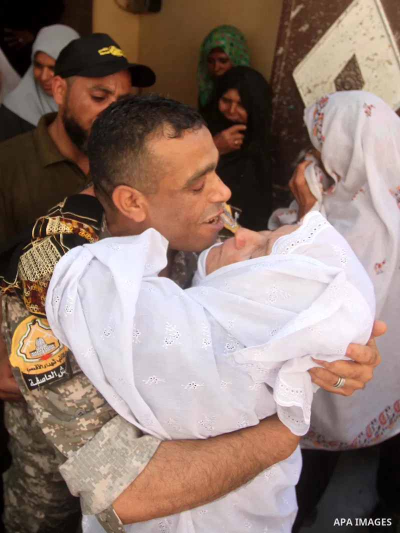 Freed Palestinian prisoner Mahmoud Abu Amra is welcomed by a relative upon his release from an Israeli jail, at his home in Deir al-Balah in the central Gaza Strip, July 30, 2015. Abu Amra served 12 years in the Israeli...
