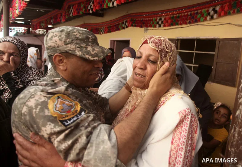 Freed Palestinian prisoner Mahmoud Abu Amra is welcomed by a relative upon his release from an Israeli jail, at his home in Deir al-Balah in the central Gaza Strip, July 30, 2015. Abu Amra served 12 years in the Israeli...