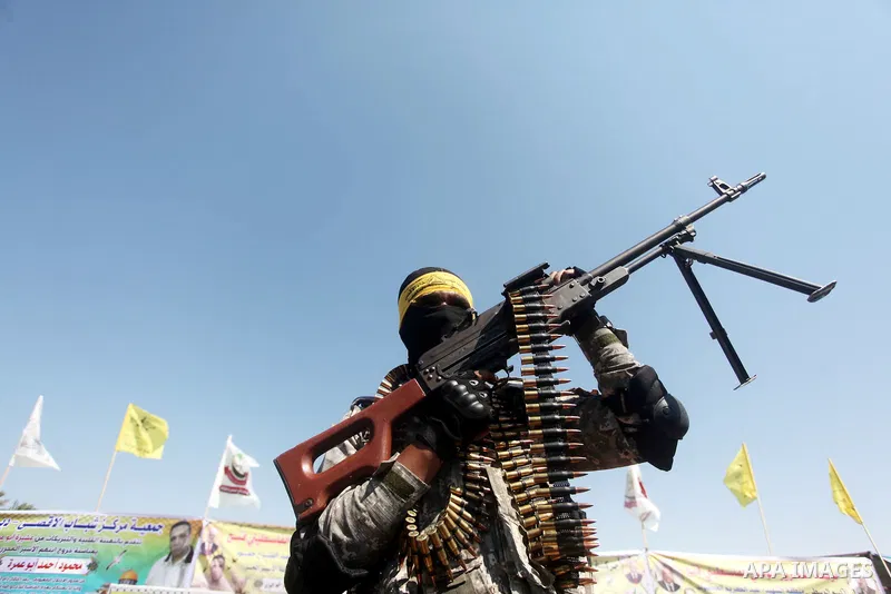 Palestinian militants of al-Aqsa brigades, the armed wing of Fatah movement, celebrate the release of prisoner Mahmoud Abu Amra from an Israeli jail, in Deir al-Balah in the central Gaza Strip, July 30, 2015. Abu Amra se...