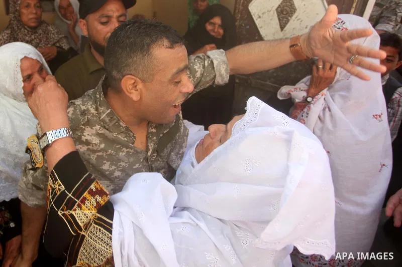Freed Palestinian prisoner Mahmoud Abu Amra is welcomed by a relative upon his release from an Israeli jail, at his home in Deir al-Balah in the central Gaza Strip, July 30, 2015. Abu Amra served 12 years in the Israeli...