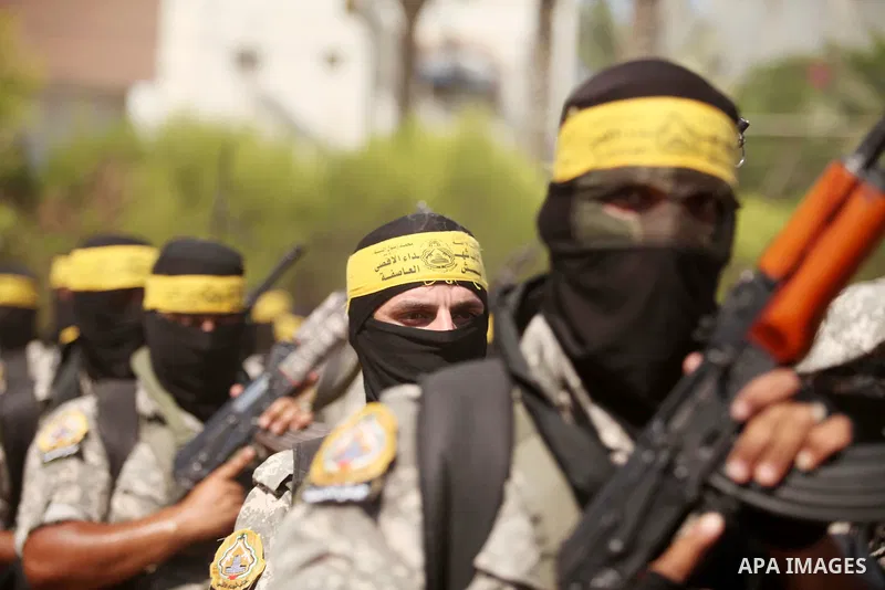 Palestinian militants of al-Aqsa brigades, the armed wing of Fatah movement, celebrate the release of prisoner Mahmoud Abu Amra from an Israeli jail, in Deir al-Balah in the central Gaza Strip, July 30, 2015. Abu Amra se...