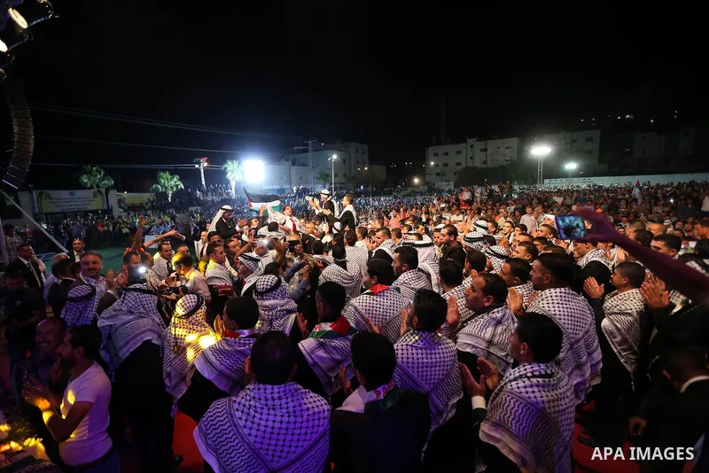 Palestinian grooms take part in a mass wedding ceremony in the West Bank city of Nablus, on July 30, 2015. Nearly 120 Palestinian couples were married in a ceremony supported by Palestinian President Mahmoud Abbas. Photo...