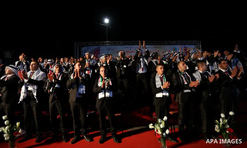 Palestinian grooms take part in a mass wedding ceremony in the West Bank city of Nablus, on July 30, 2015. Nearly 120 Palestinian couples were married in a ceremony supported by Palestinian President Mahmoud Abbas. Photo...